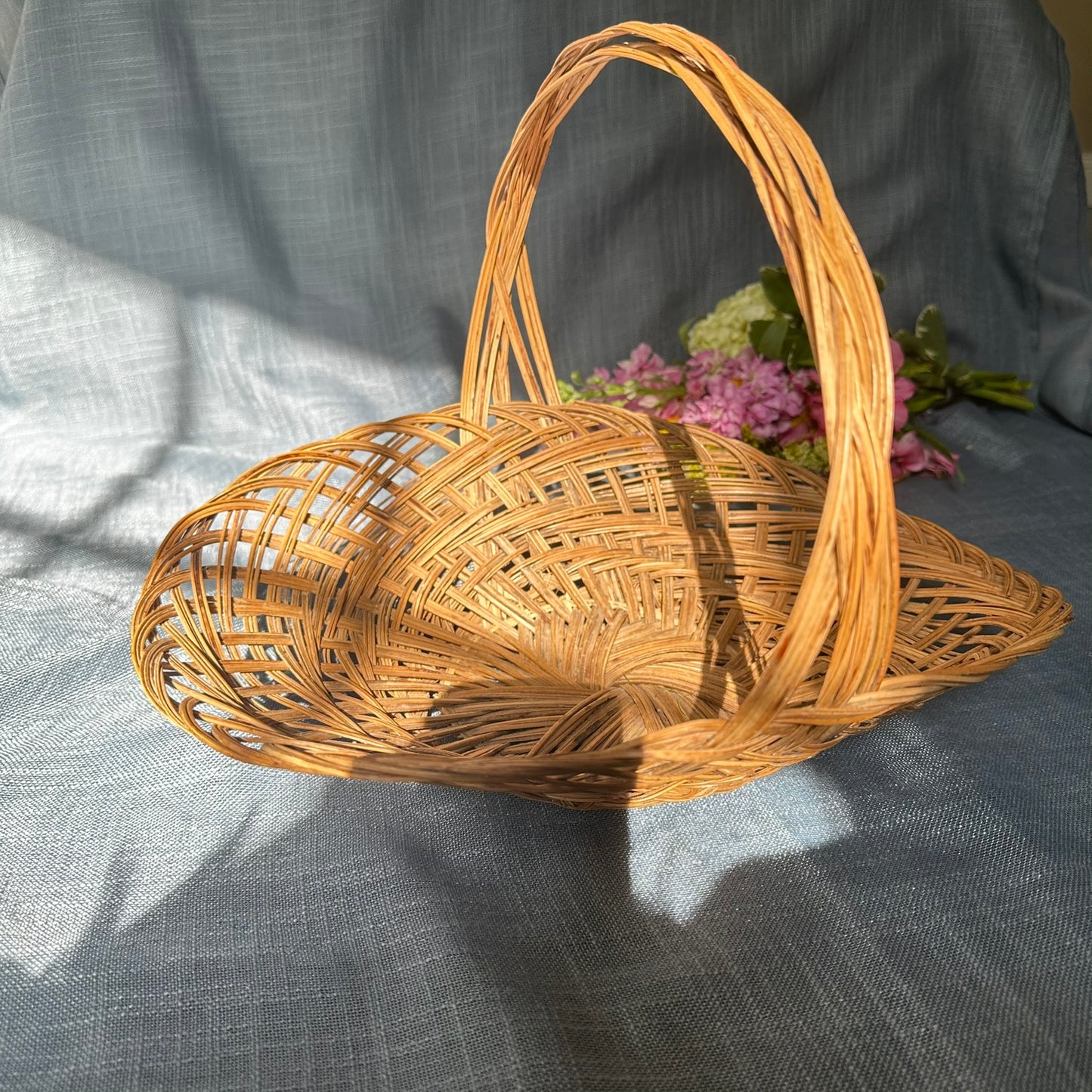 Vintage Woven Rattan Basket with Twisted Handle