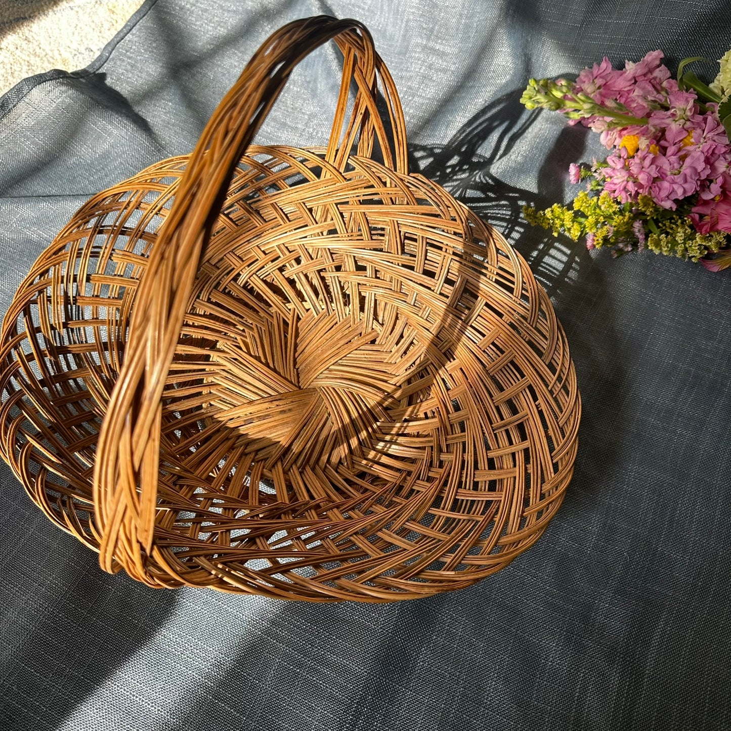 Vintage Woven Rattan Basket with Twisted Handle